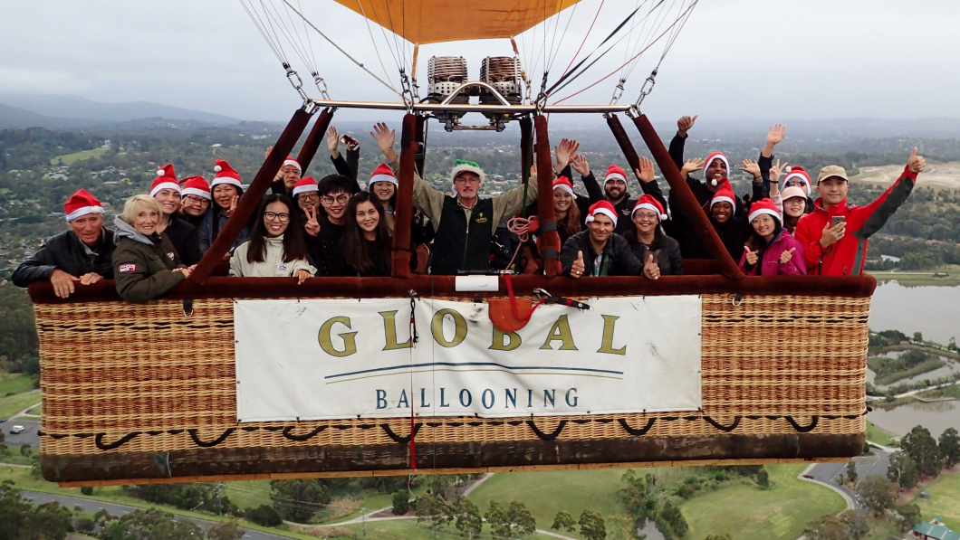 A group inside a hot air balloon over the Yarra Valley with Global Ballooning. 