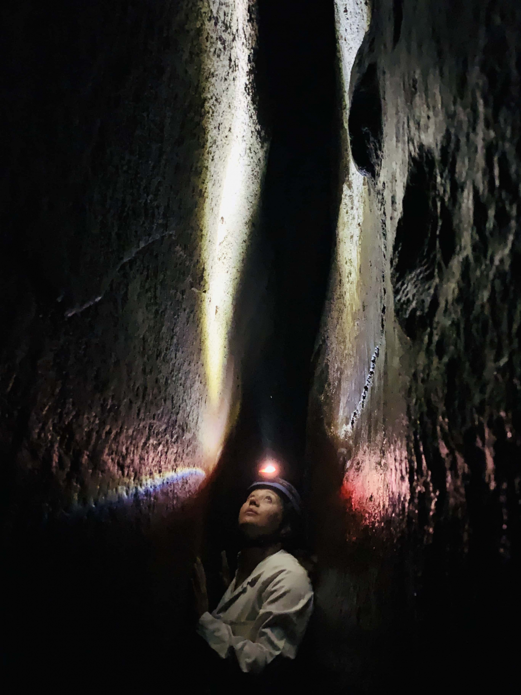 Person inside a cave with Warburton Adventure Company. 